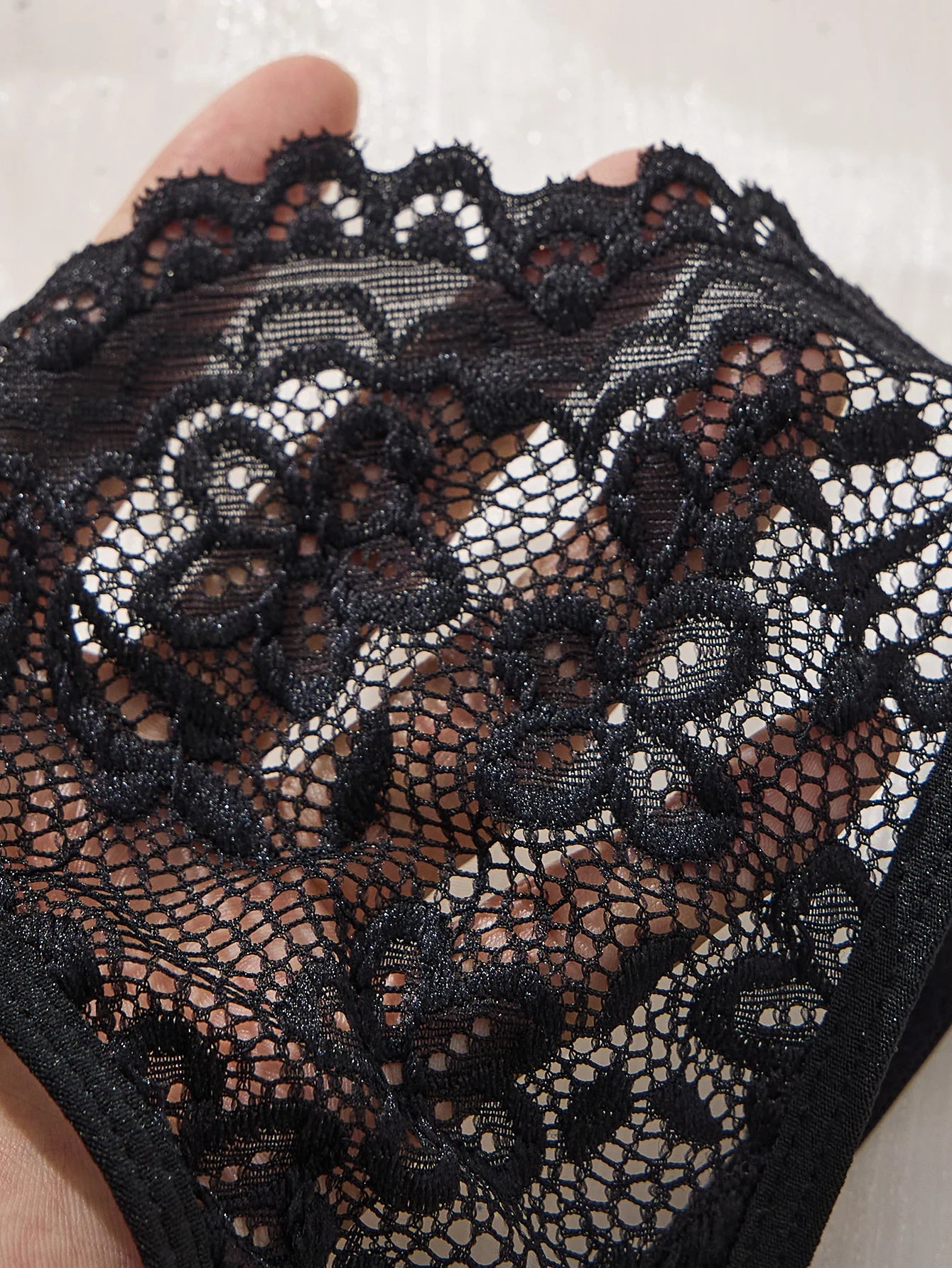 A set of black sexy lingerie, featuring leopard print and floral patterns. The lace design combines charm with sexiness ZA825182