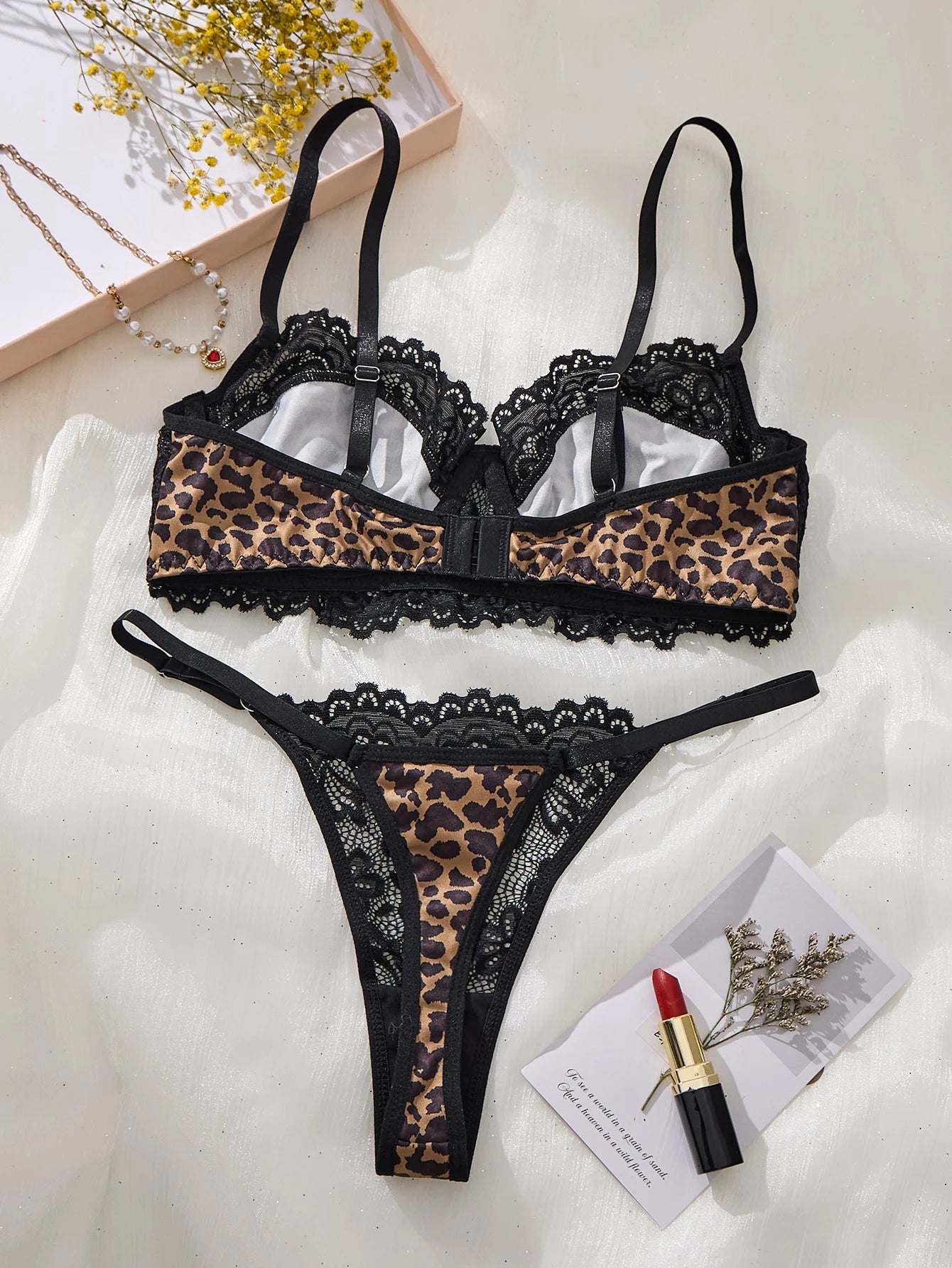 A set of black sexy lingerie, featuring leopard print and floral patterns. The lace design combines charm with sexiness ZA825182